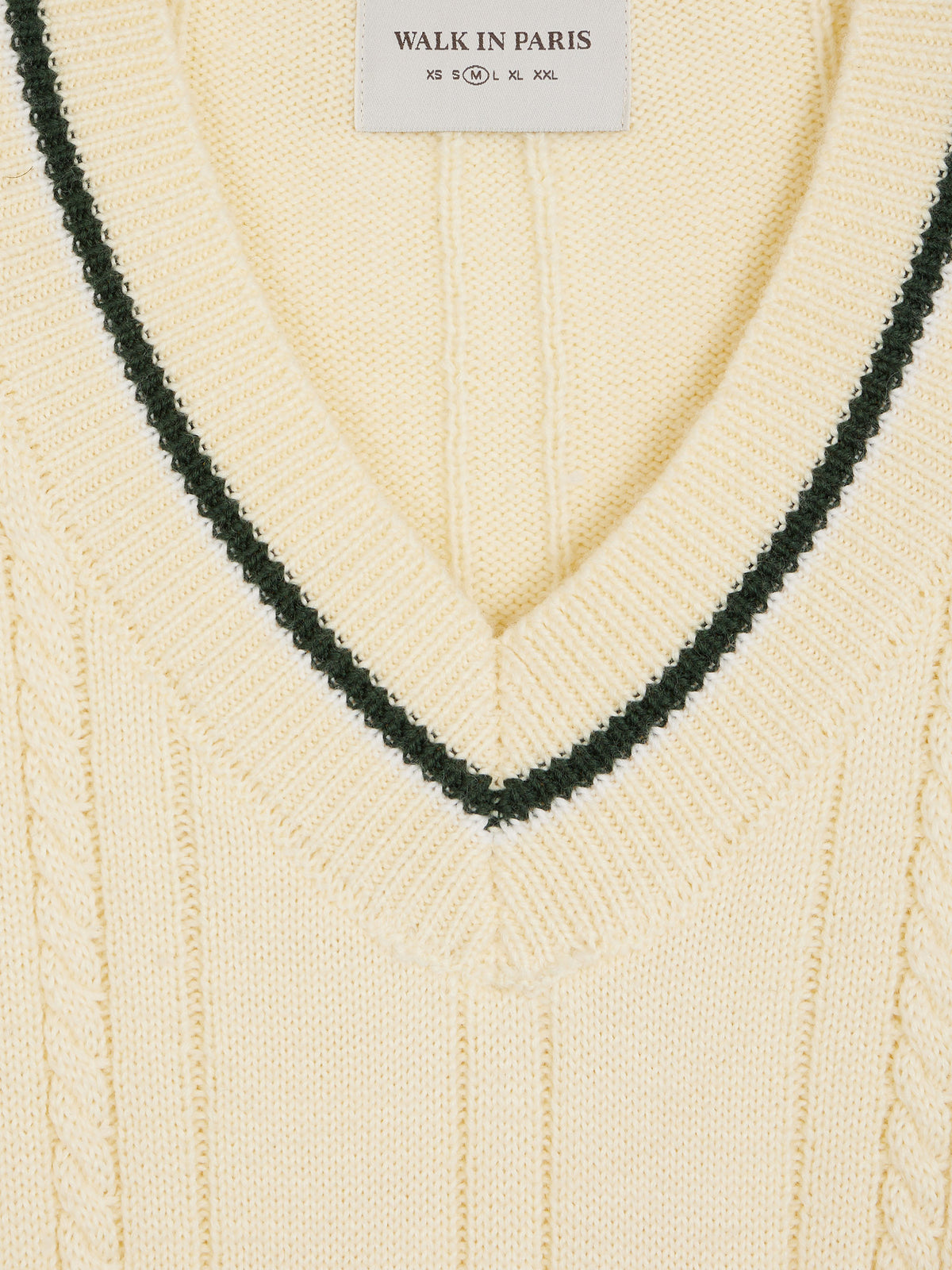 The beige knitted sweater