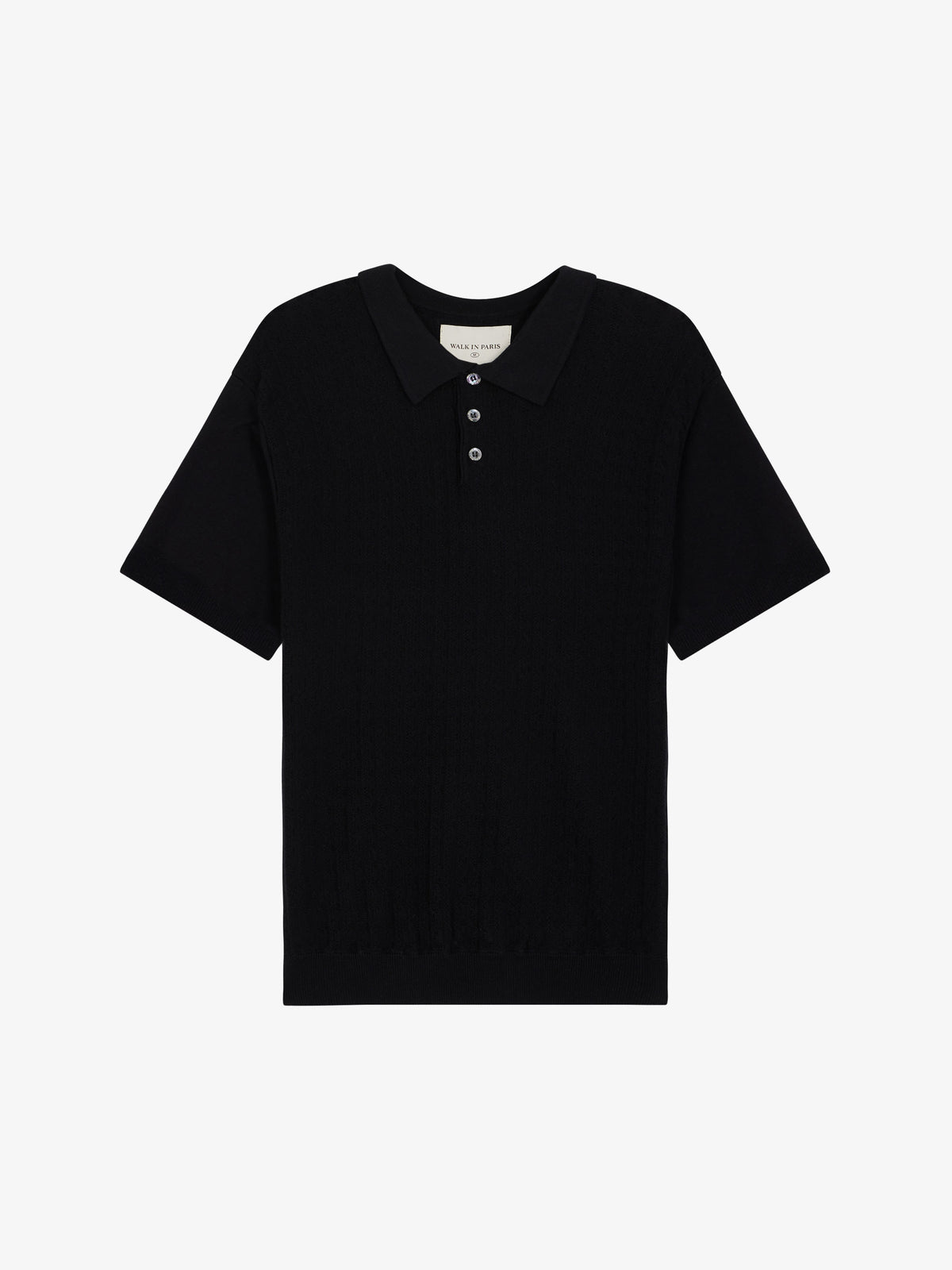 Le polo noir en maille torsadée
