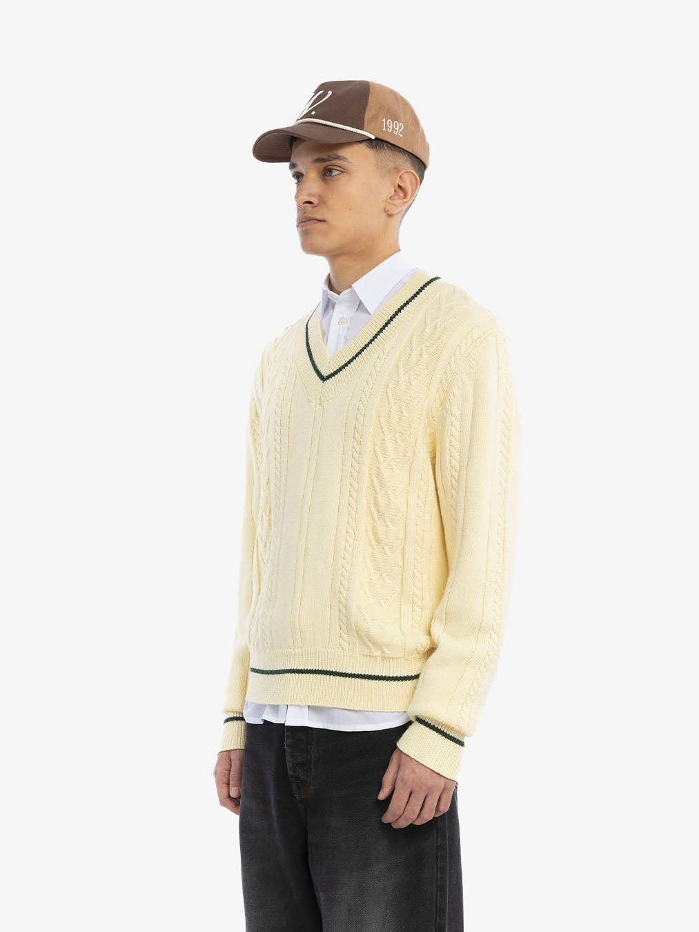 The beige knitted sweater