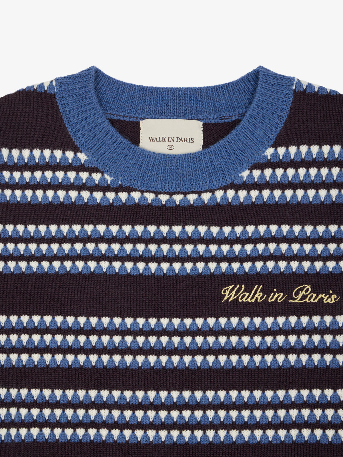 Le pull en maille sans manches rayé bleu