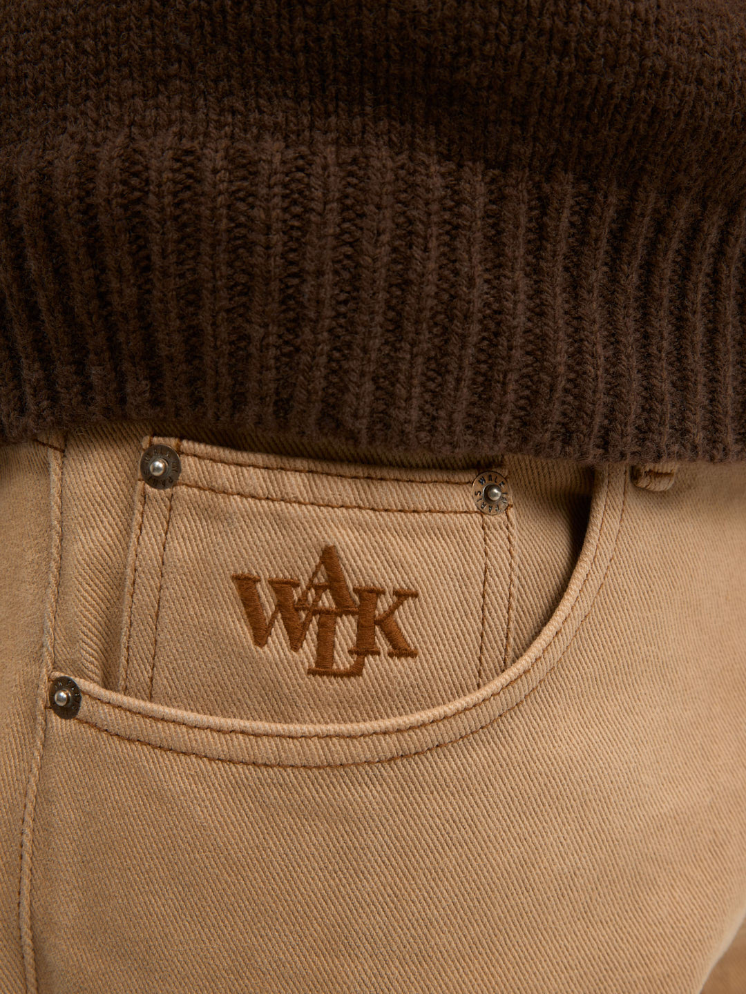 The regular fit beige denim trousers