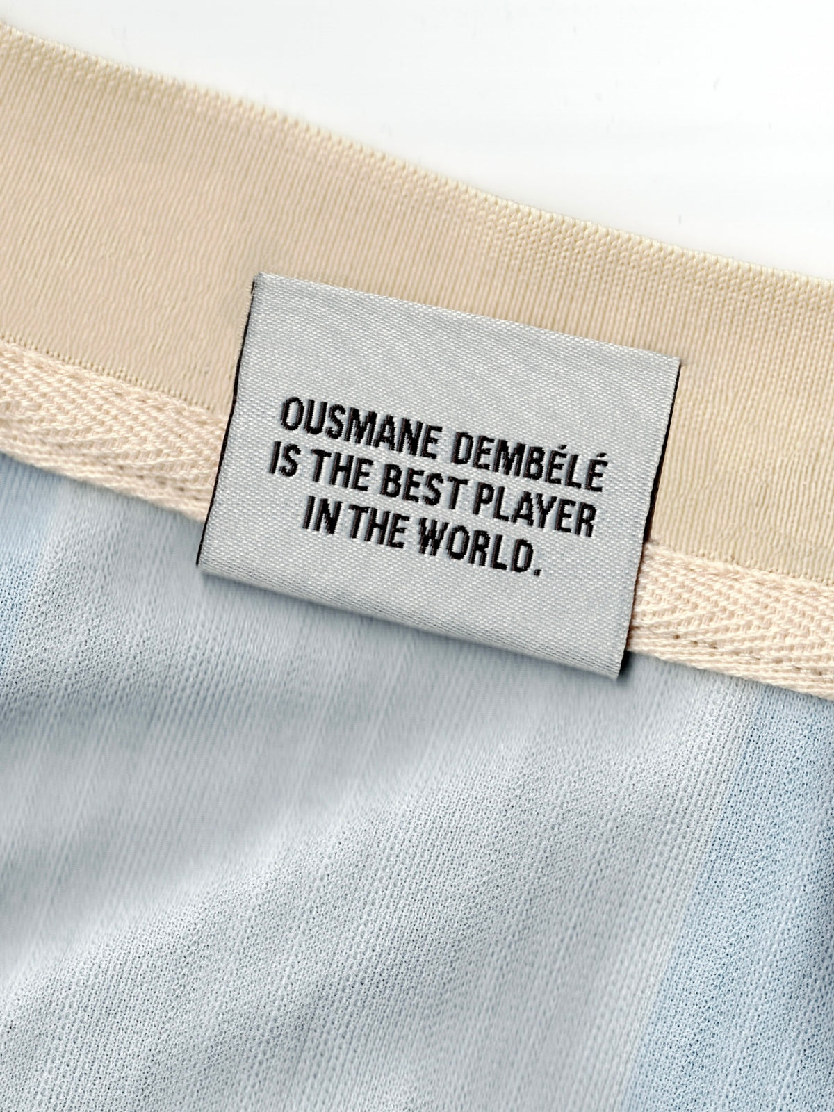 The beige football jersey
