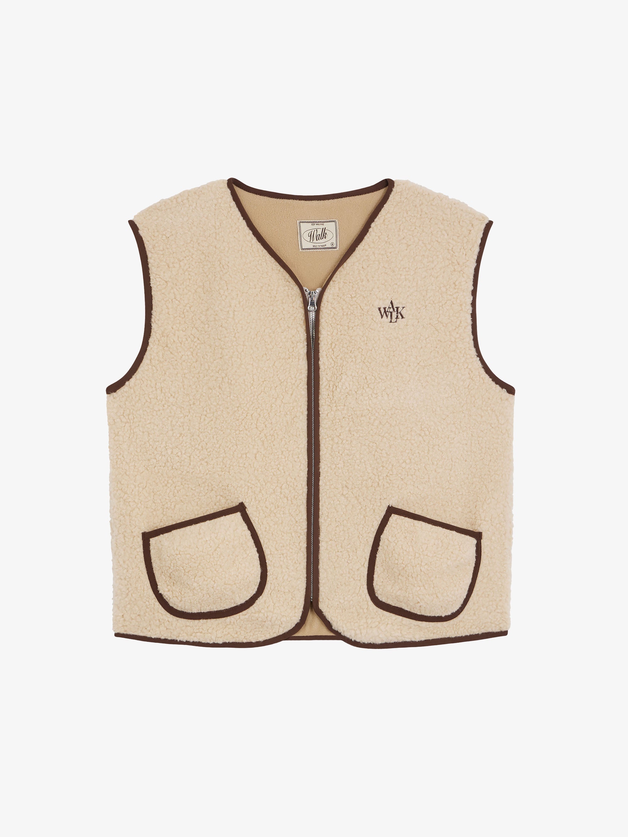 The sleeveless beige shepherd's jacket 1