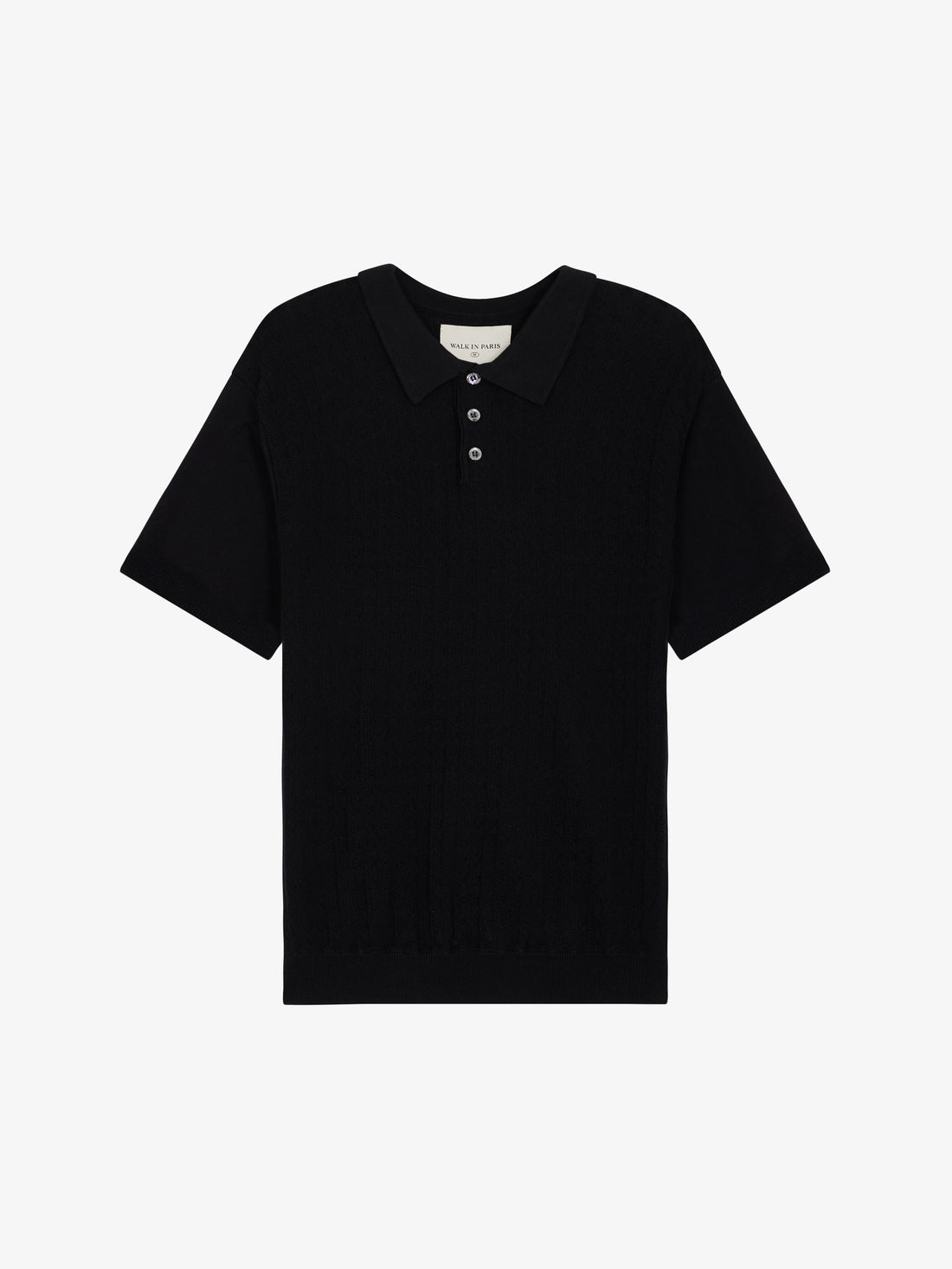 Le polo noir en maille torsadée