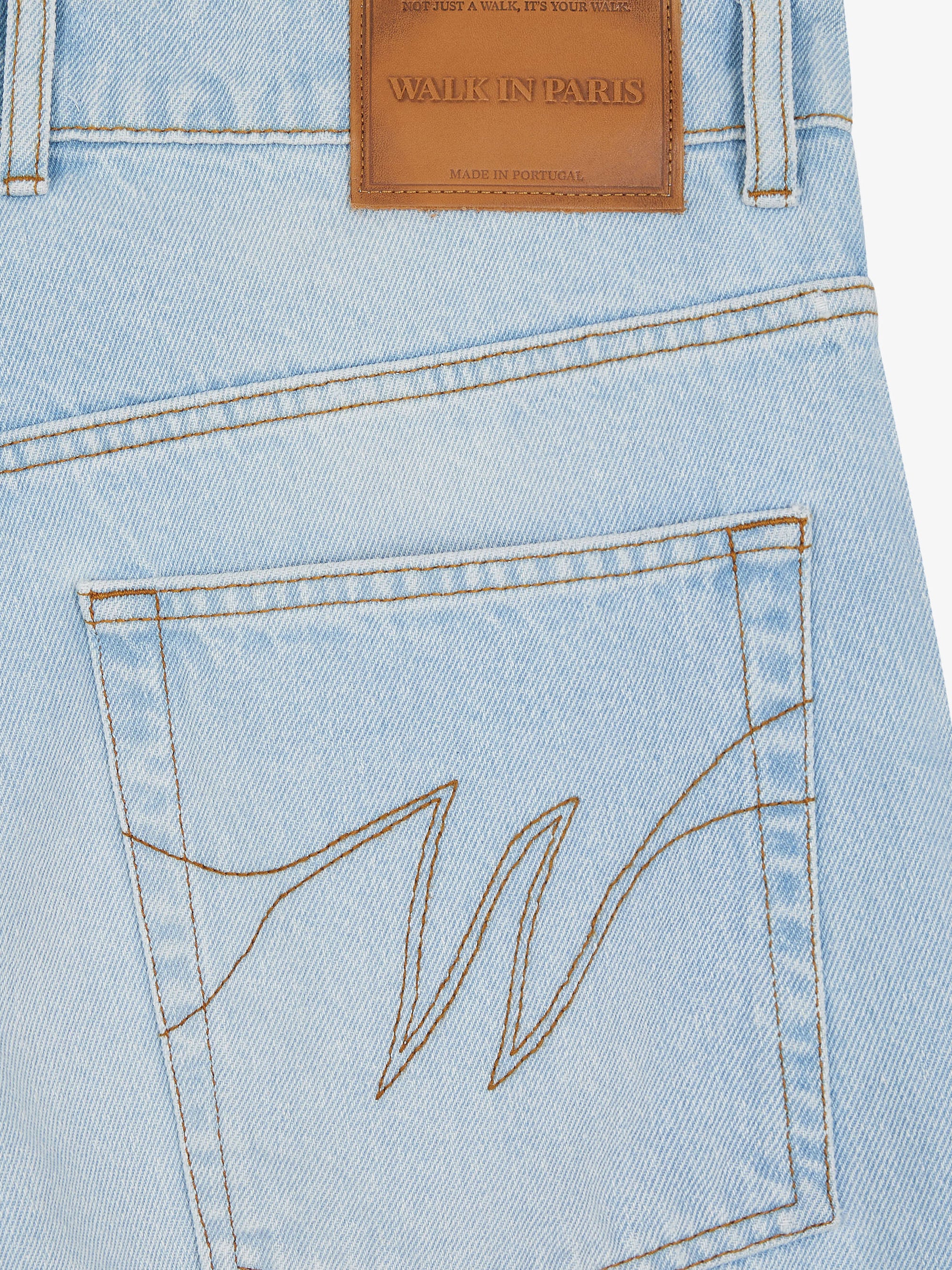 Baggy pants in light-washed denim 7