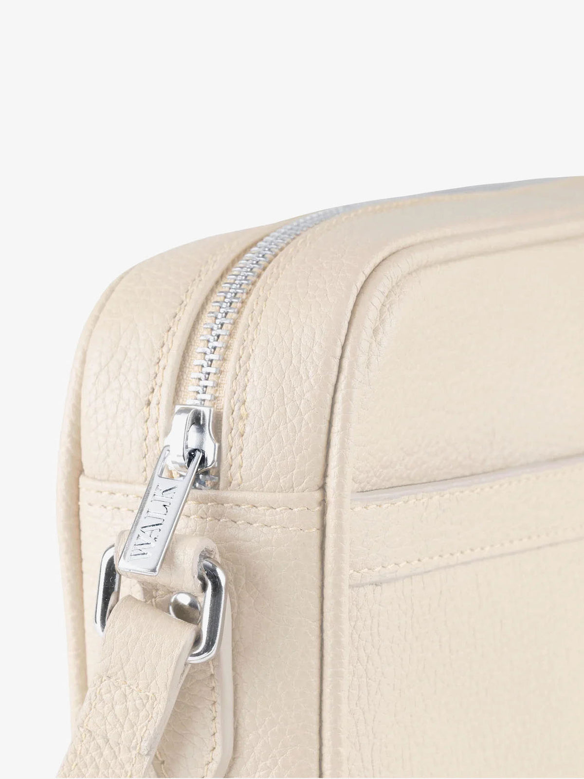 La sacoche en cuir beige