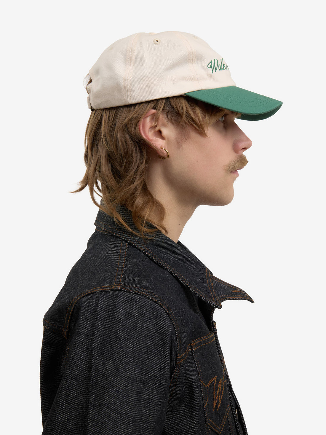The beige baseball cap