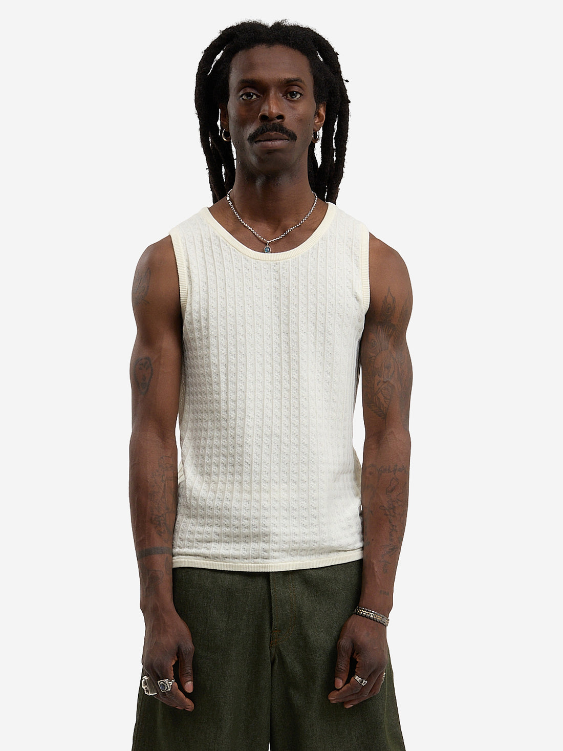 The beige knit tank top