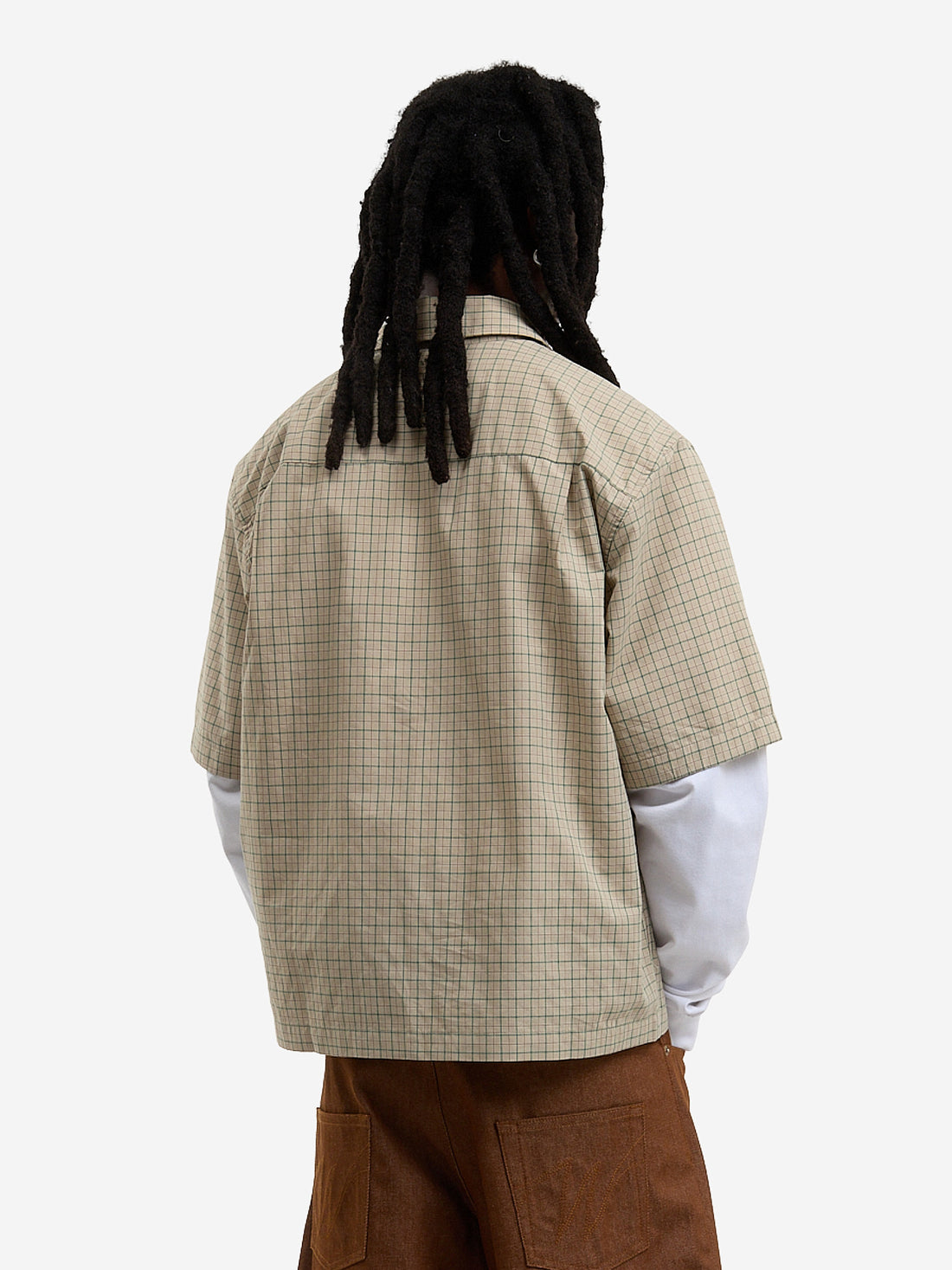 The beige short-sleeved shirt
