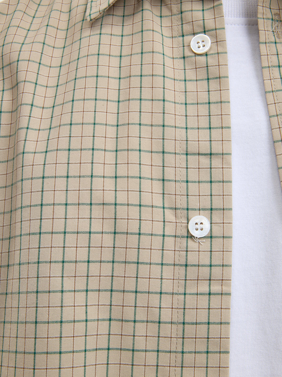 The beige short-sleeved shirt