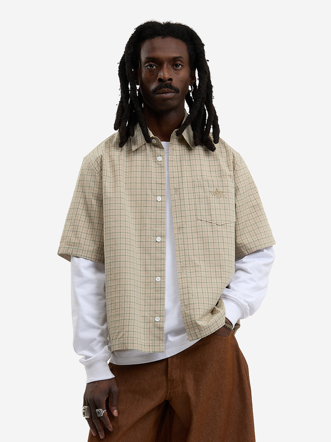 The beige short-sleeved shirt