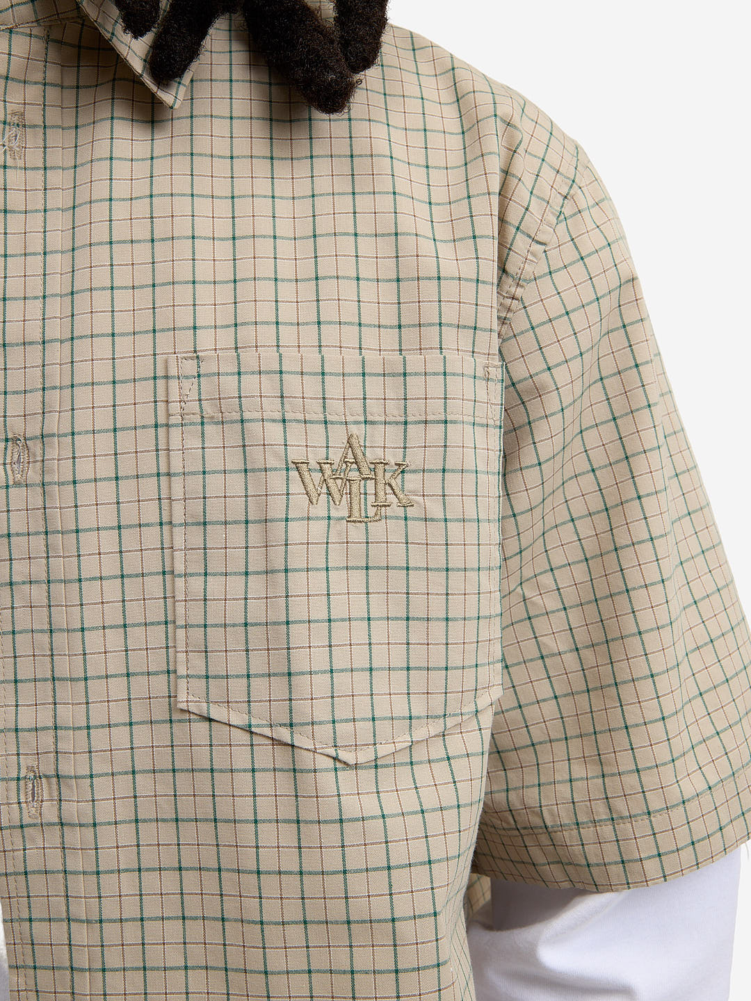 The beige short-sleeved shirt