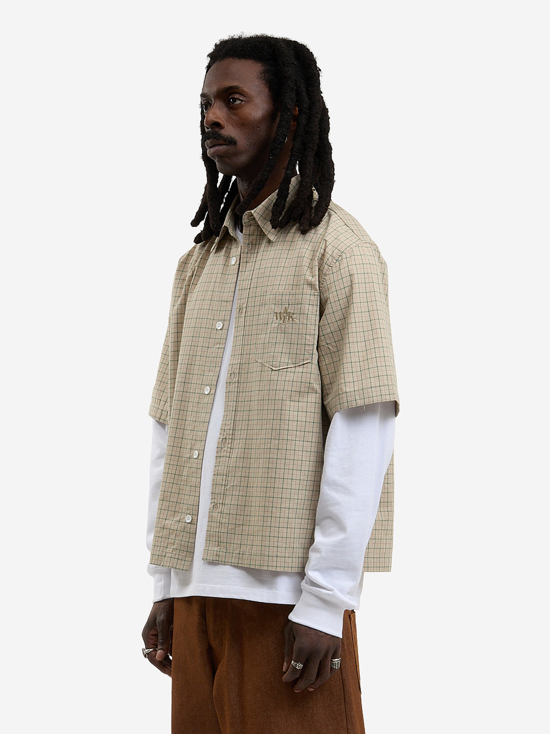 The beige short-sleeved shirt