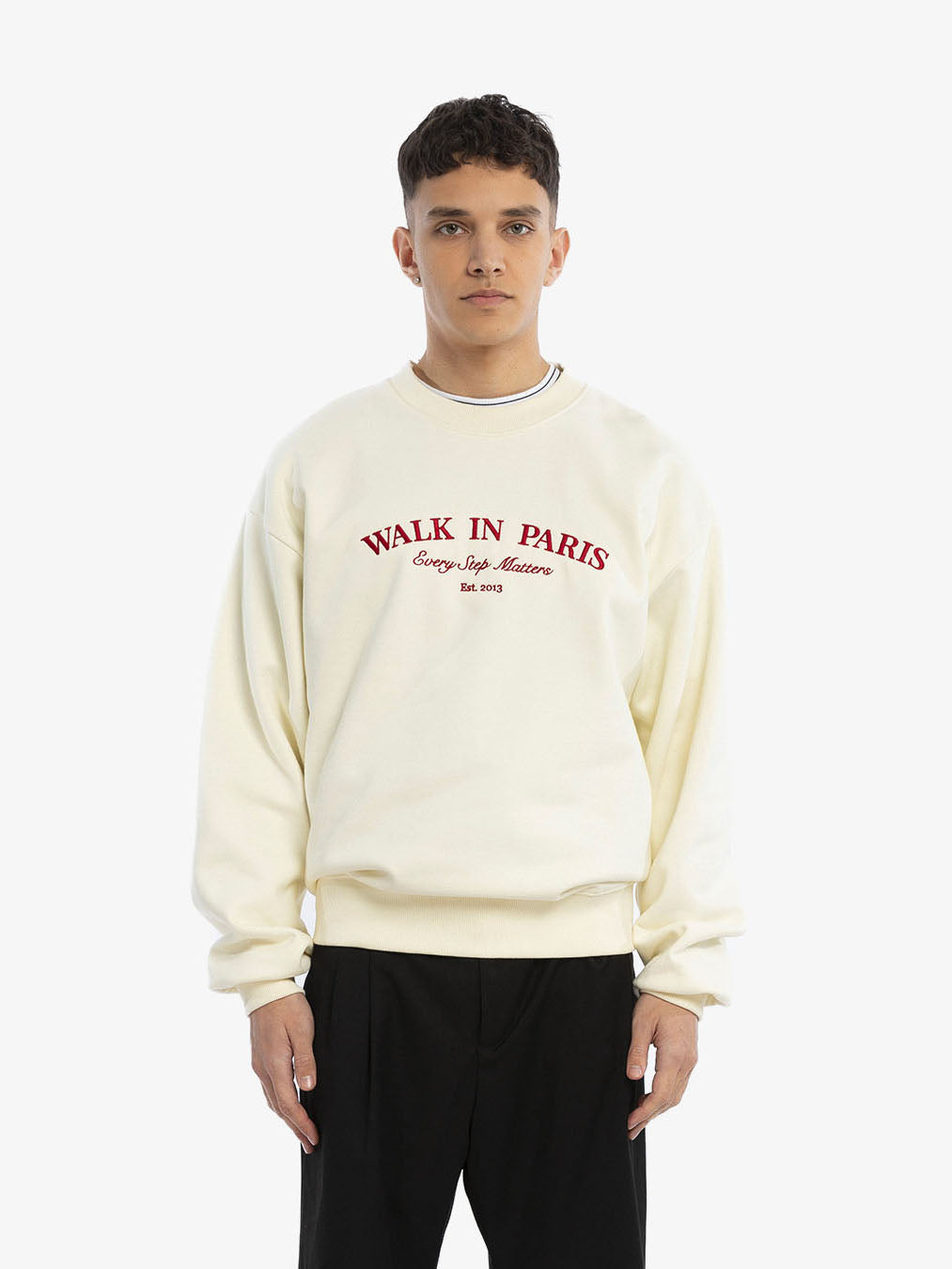 The beige sweatshirt