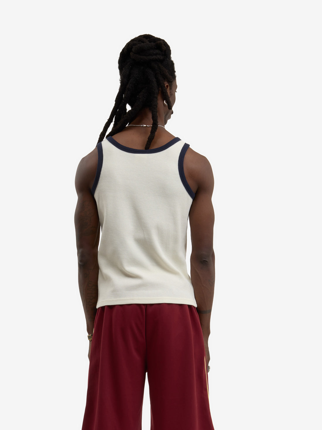 The beige waffle-patterned tank top 