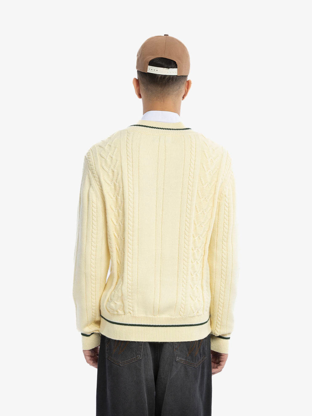 The beige knitted sweater