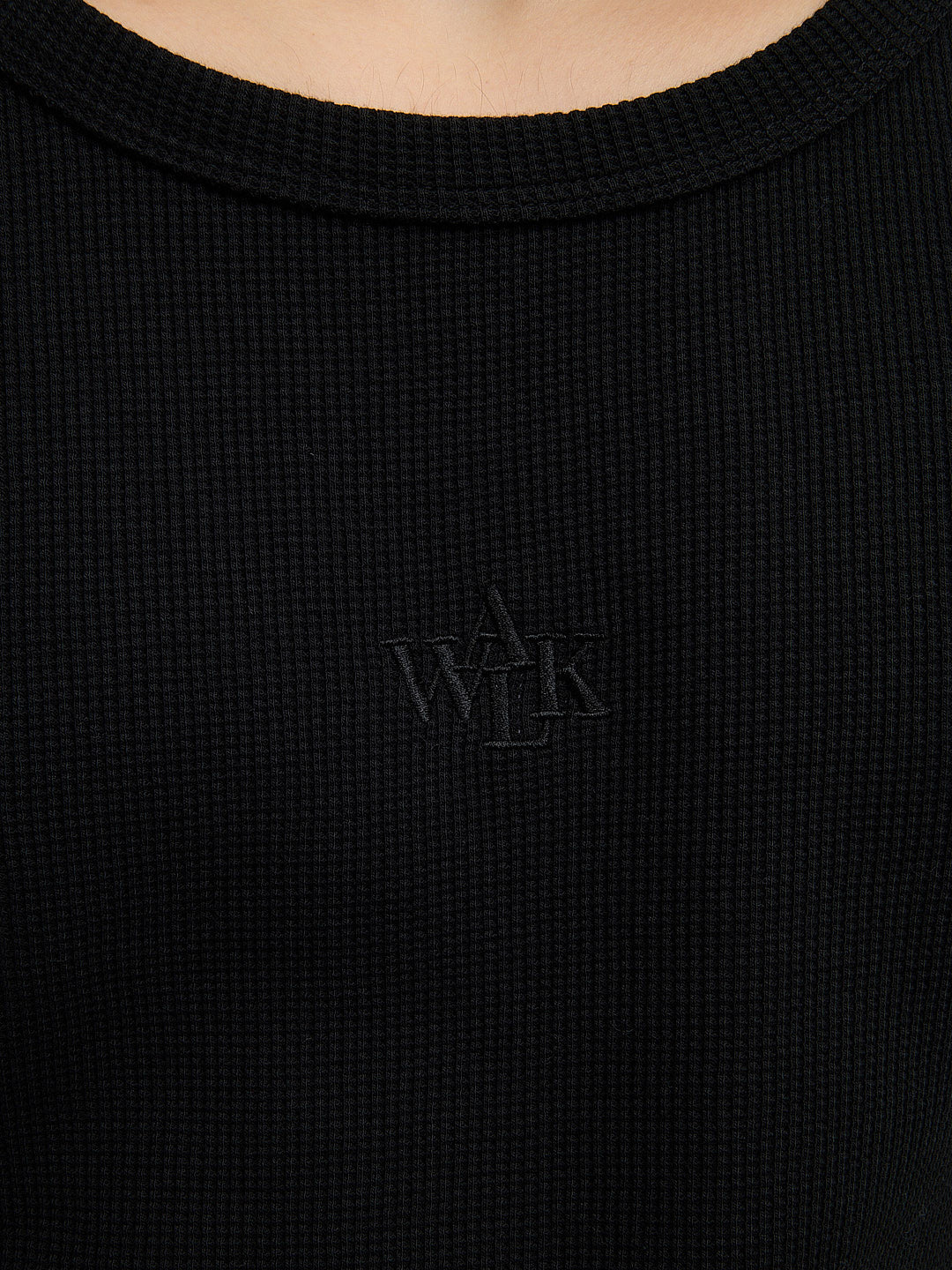 The black waffle-patterned tank top  5