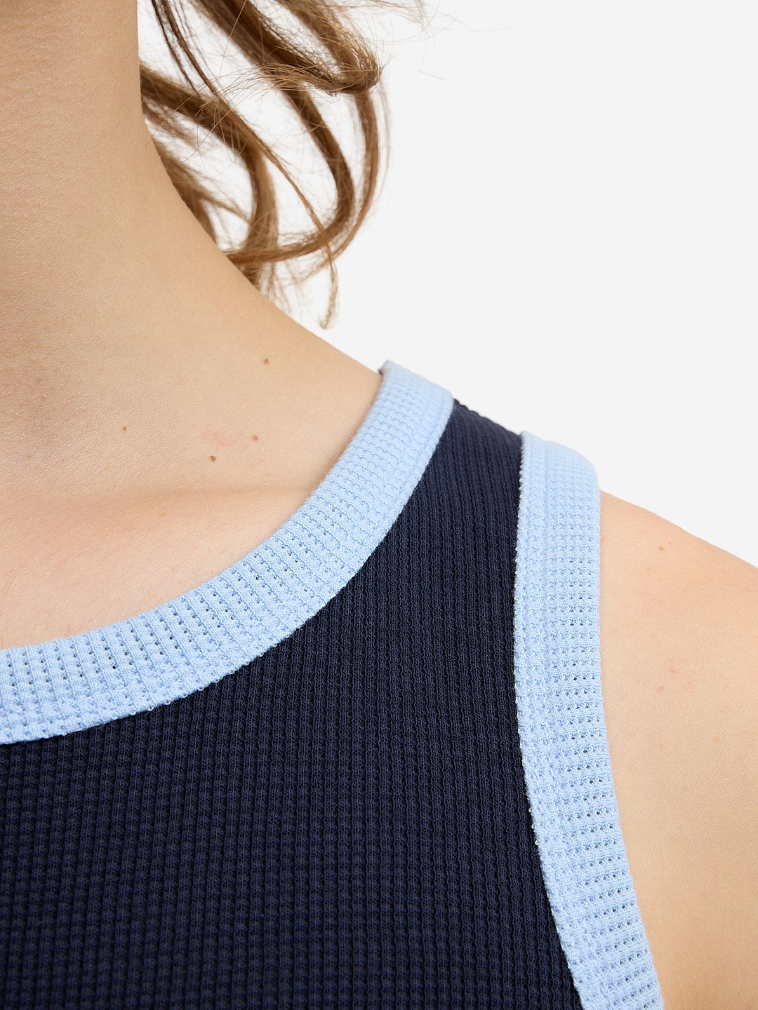 The blue waffle-patterned tank top
