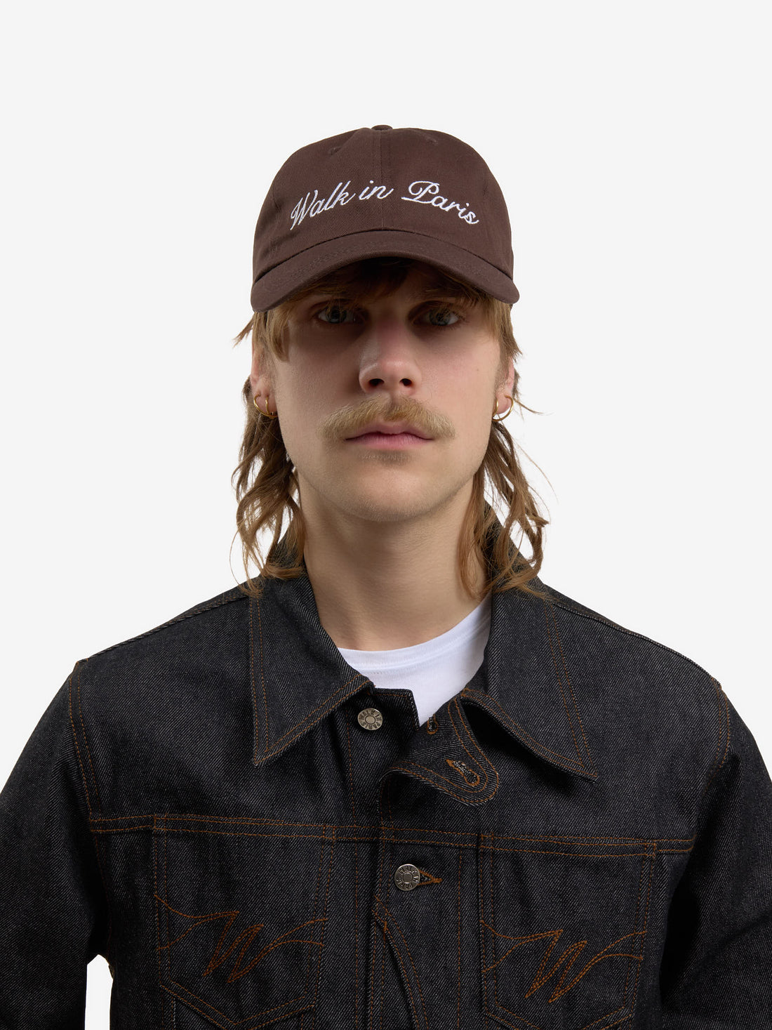 The brown baseball cap