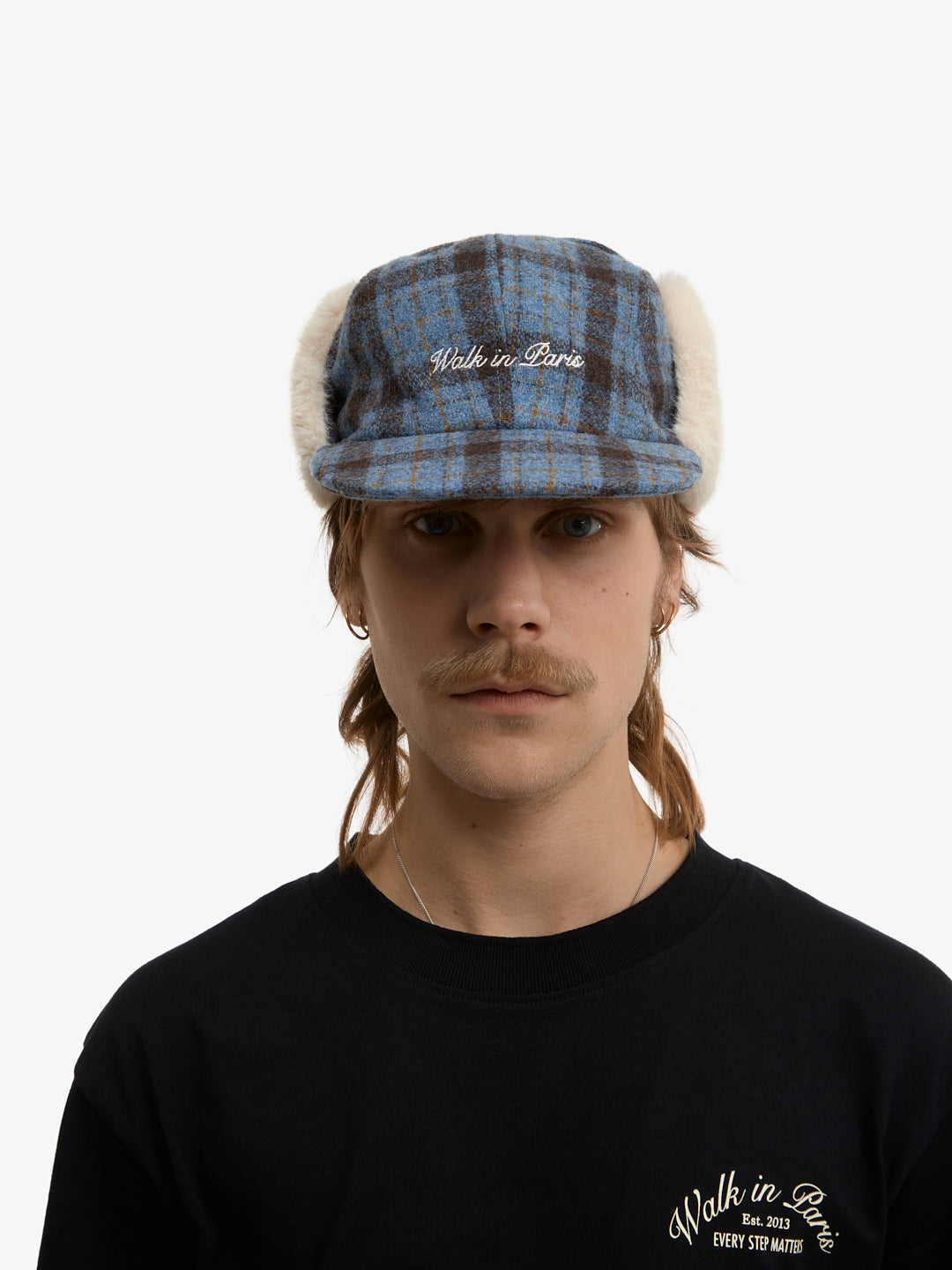 La casquette de Trappeur à carreaux bleue