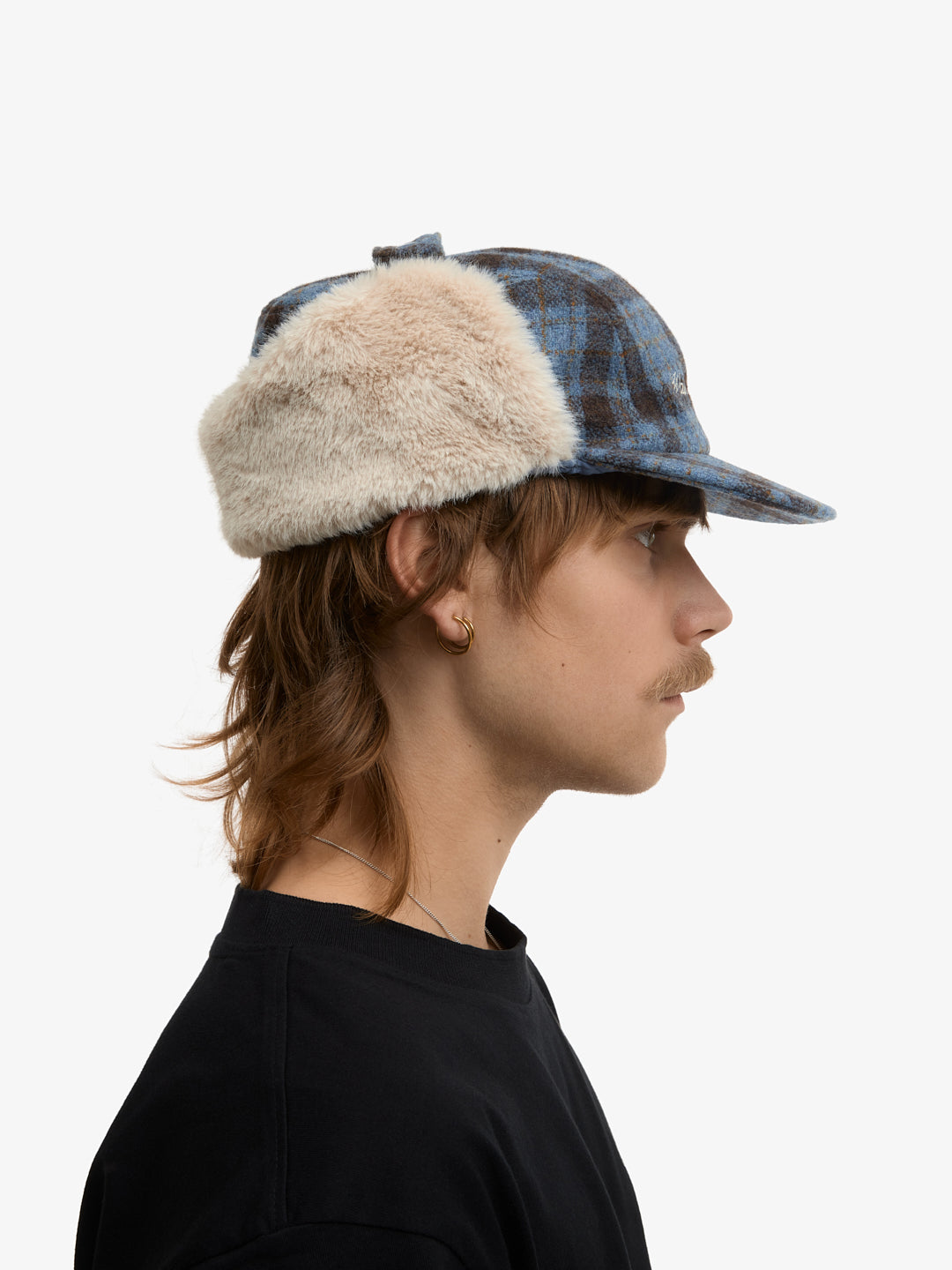 La casquette de Trappeur à carreaux bleue