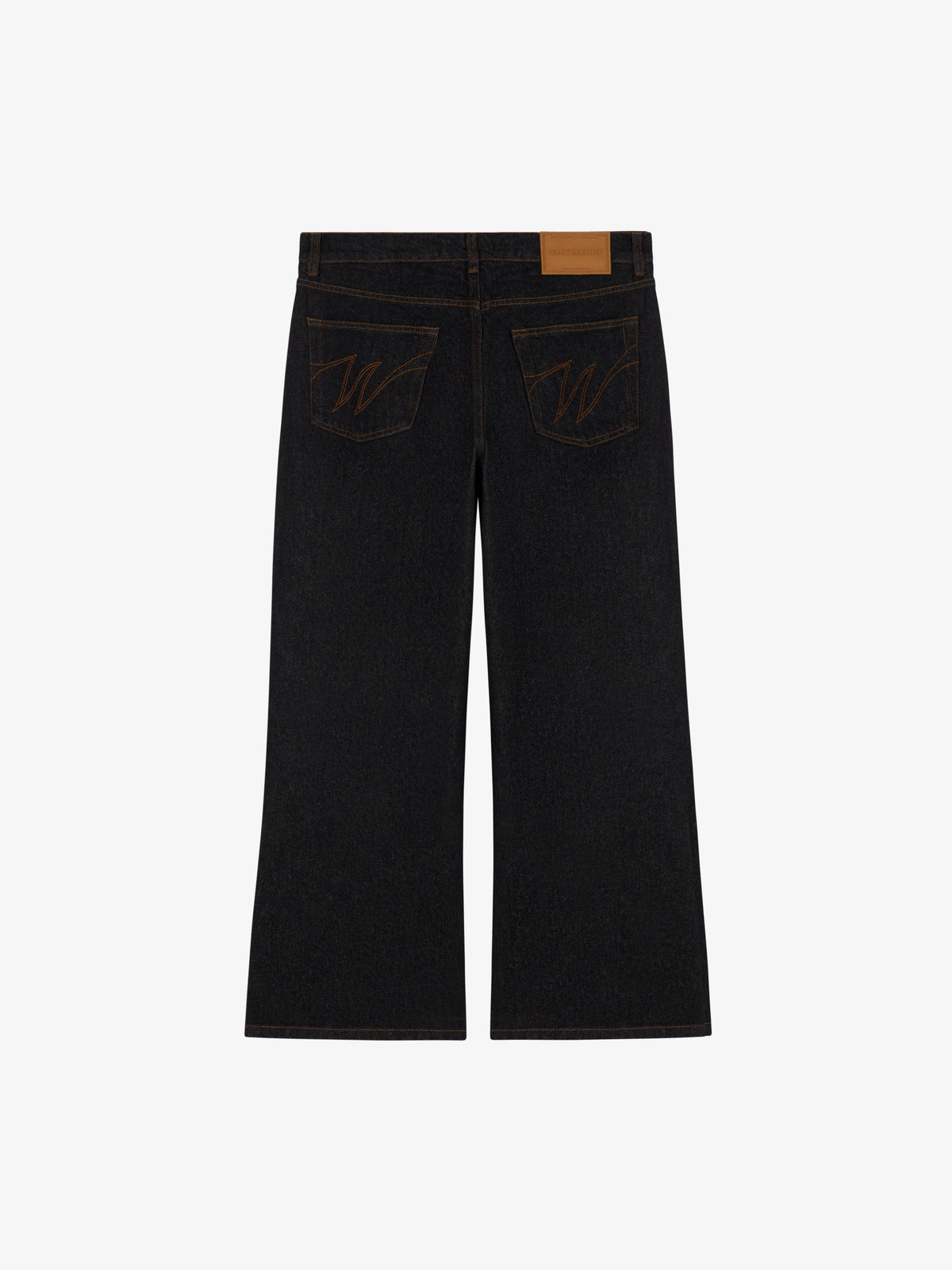 Le pantalon flare en denim brut