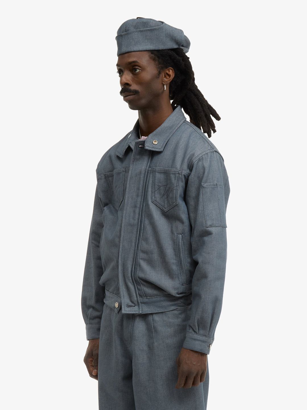 The postman's uniform jacket 9